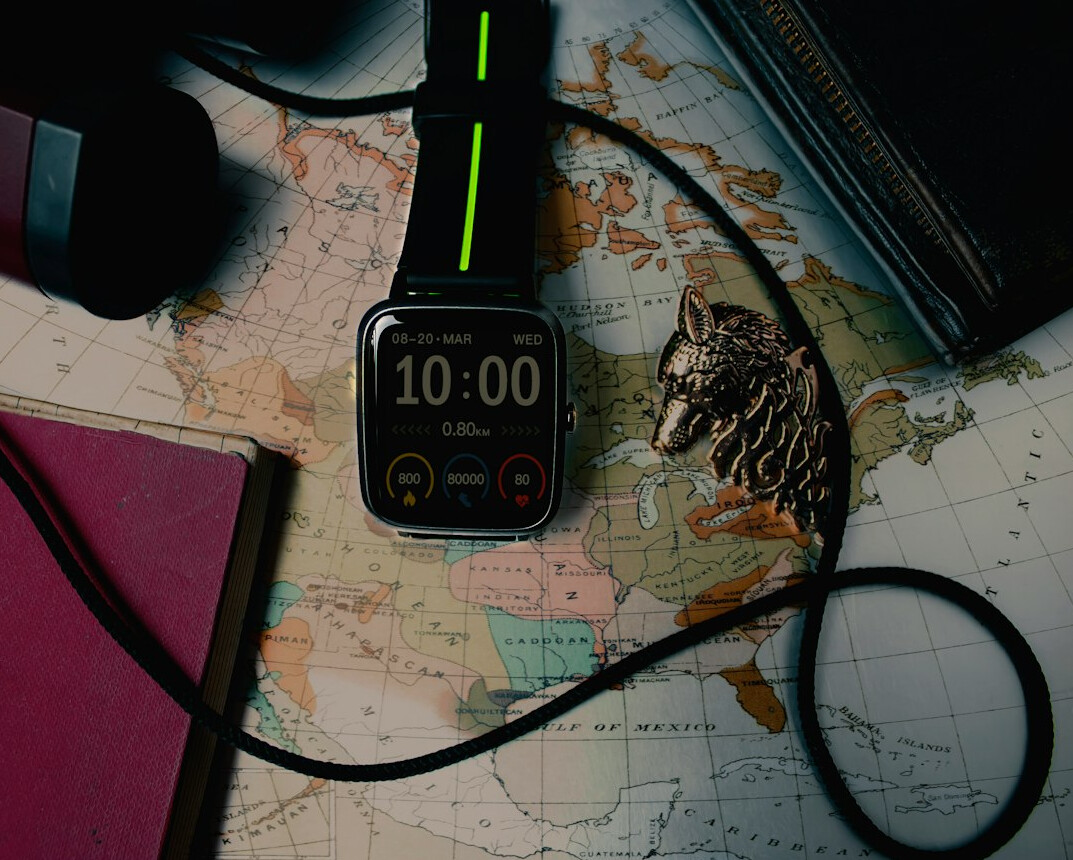 Travel planning with a map, camera and notebook on a table