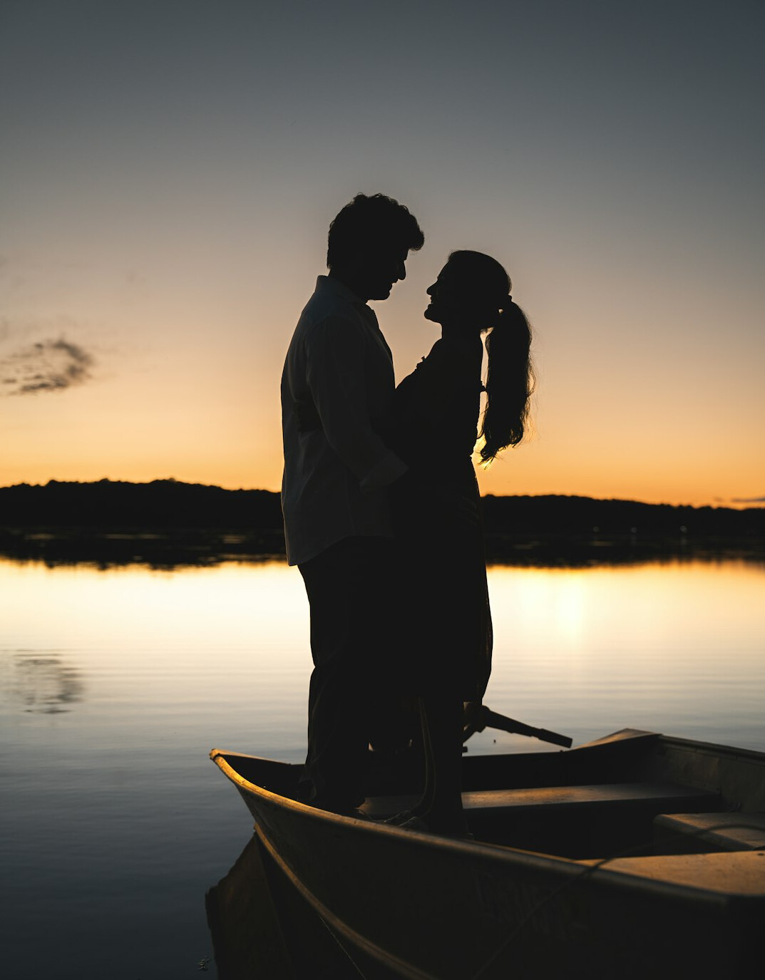 couple on boat in lake